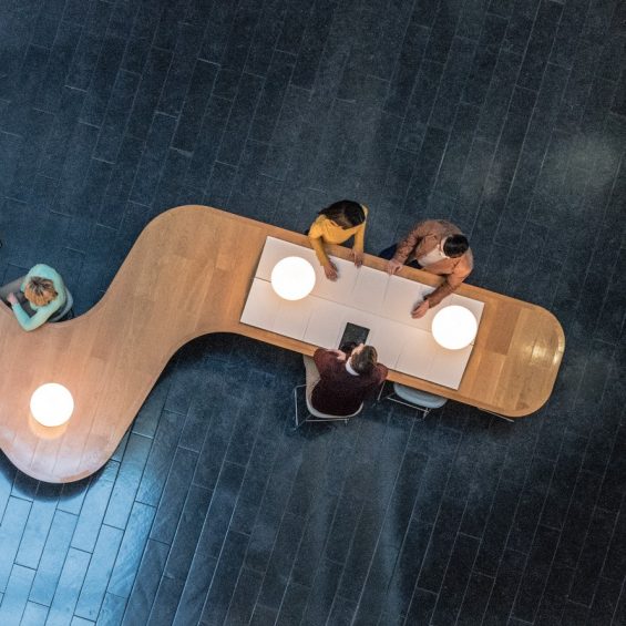 people-at-a-meeting-at-a-long-table-from-above